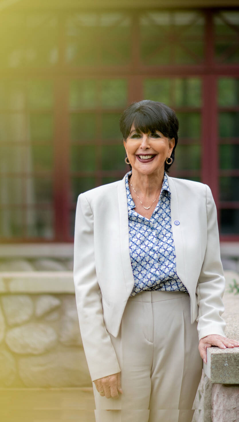 Portrait of President Mantella standing on campus